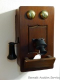 Neat old telephone cabinet has been made to hide a wall phone. Cabinet measures 14-1/2