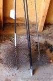 Eight inch and six inch flue brushes. Eight inch brush has three 4' sections