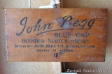 Varnished wooden crate section boasts John Begg Blue Cap Blended Scotch Whisky. Approx. 17