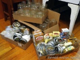 Ball & Kerr quart and pint canning jars, plus a quantity of lids and rings.