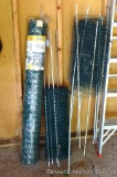 4' x 50' green fence, plus two rolls of coated chicken wire with stakes.