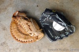 Two baseball mitts for right handers, plus a hard ball and a soft ball. One by Wilson, one by