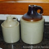 Two stoneware jugs. Tallest is approx. 9