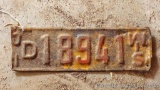 Most of an antique Wisconsin license plate is 15