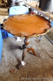 Cute antique wooden table is about 2' across. Use as is or fix it up.