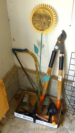 29" loppers; 24" pruning saw; bulb planter; garden tools.