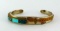 Cuff style bracelet has turquoise and copper colored accents. Marked 'Sterling C. Lee. Measures