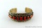 Cuff style bracelet with red stone accent, marked 'Mark Yazzle Sterling'. 2-3/8