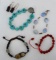 Four pretty bracelets, plus a pair of earrings. Bracelet with turquoise heart beads opens to 8-1/2