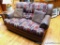 Loveseat with faux leather with fabric cushions; measures 63