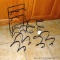 Wire wine bottle holders. Spiral ones are 10