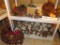 Pinecone decorations include swag, decorative garland (on bottom shelf), ornaments, more.