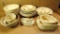 Sixteen pcs. Of tan pottery & dinnerware pcs. by Irene Gimeno. Includes soup bowls, butter dish,