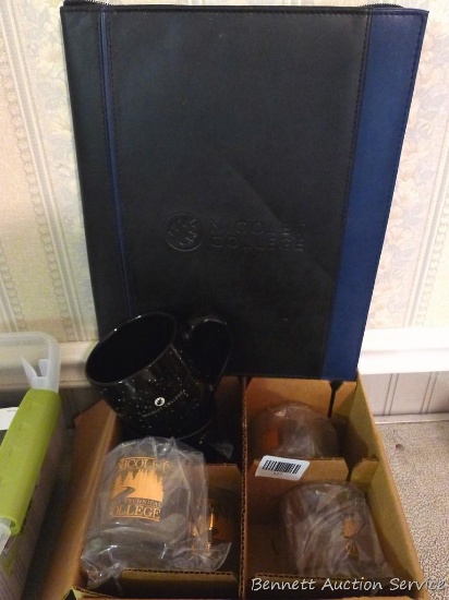 Nicolet College folder and several mugs. Folder is about 14" tall.