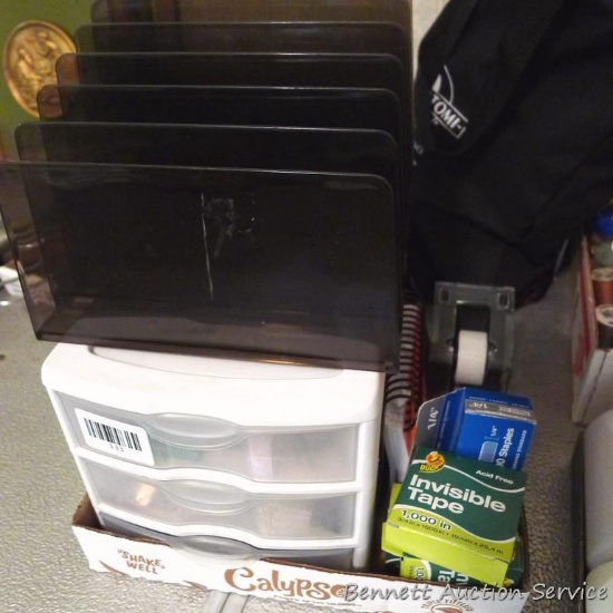 Staplers, markers, binder clips, Tape dispenser, Duck tape refills, more. Storage box is about 7" x