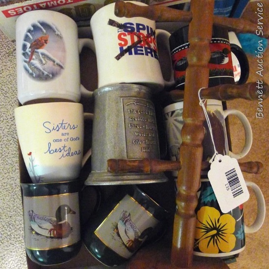 Several coffee mugs and a 15" mug tree.