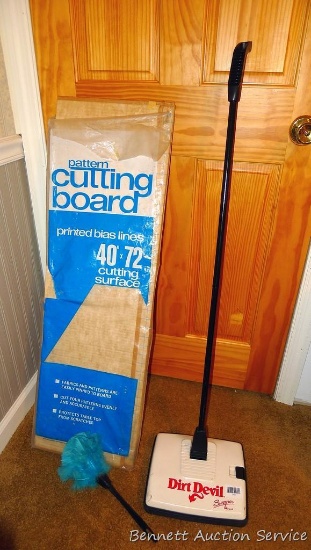 Dirt Devil Sweeper is model No M-060. Looks like it picks things up. Stands about 45" tall.