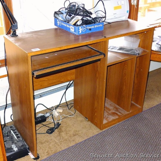 Rolling wooden computer desk is 40" x 16" x 31".