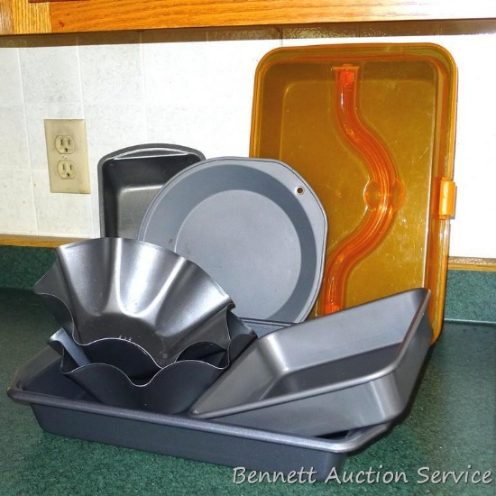Cake pan with snap on lid, has carry handle; Wilton 9 x 13 cake pan; four other baking pans.