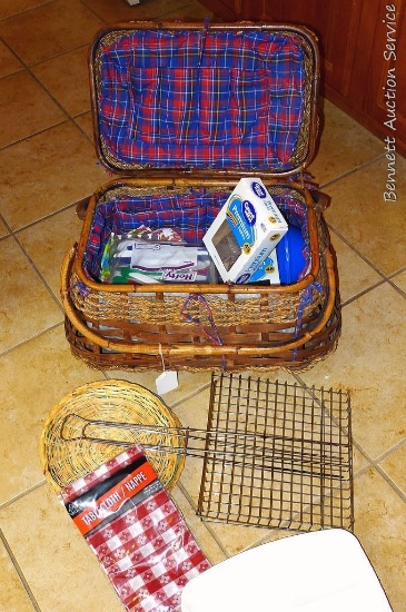 Nice picnic basket is 14" x 20" x 12" tall. Has picnic supplies inside and a wire campfire roaster