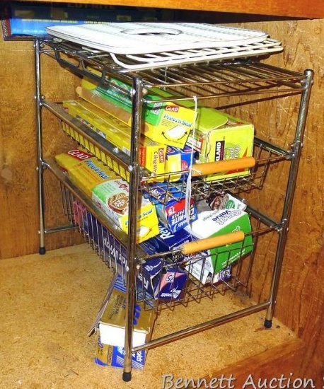 Metal storage rack with pullout baskets is 11-1/2" x 17-1/2" x 18-1/2"; plastic wrap, foil, wax