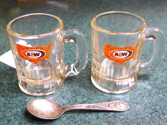 Pair of miniature A&W mugs 3-1/4" tall; silver Gerber baby spoon is 4-1/2" long.