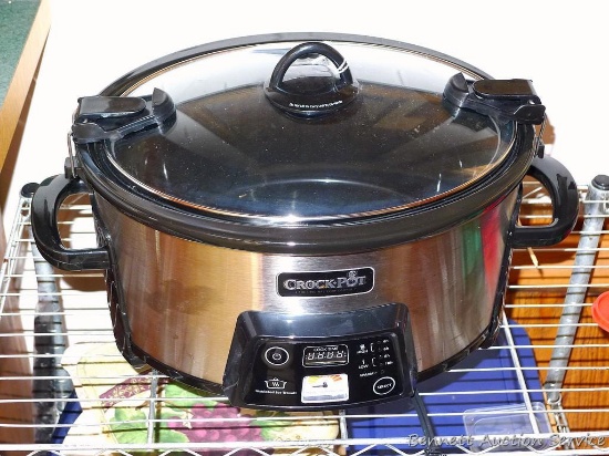 Crock-Pot slow cooker SC53 with snap on sealed lid is 17" x 12" x 10". Turns on and heats.