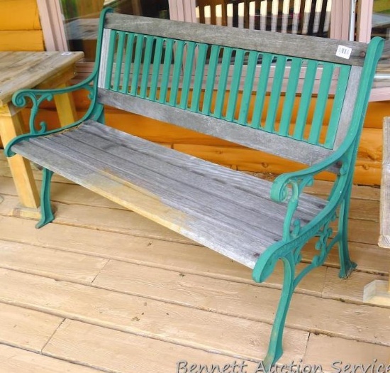 Nice sturdy cast iron and hardwood bench is about 50" x 24" x 33" tall at back.