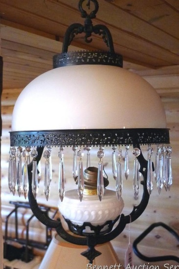 Pretty cast iron framed hanging oil lamp is about 24" x 12" wide excluding shade. Shade is almost