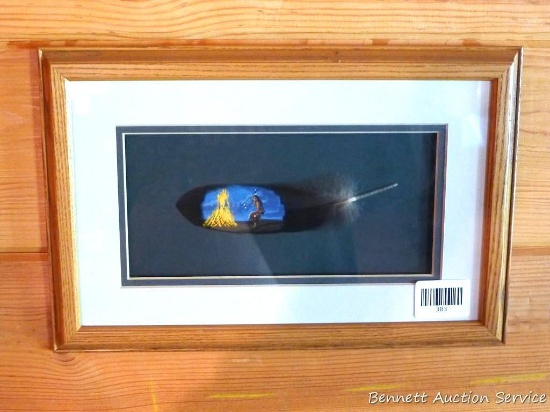 Pretty framed and matted feather has been painted with a Native American scene. Approx 15" x 10"