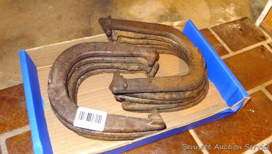 Four pair throwing horseshoes.