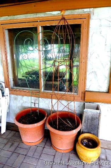 Two 20" diameter planters with wire trellis'. Taller is nearly 6' overall. Plus smaller planter and