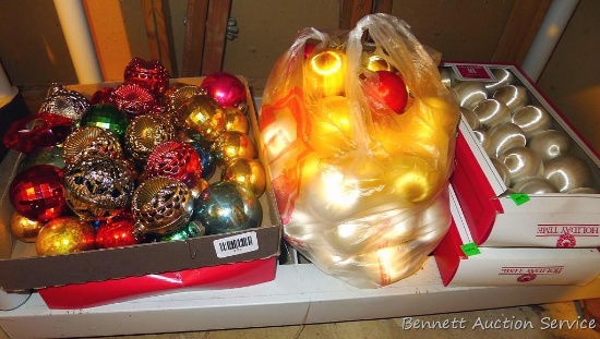 Glass and other Christmas bulb ornaments in a variety of styles.
