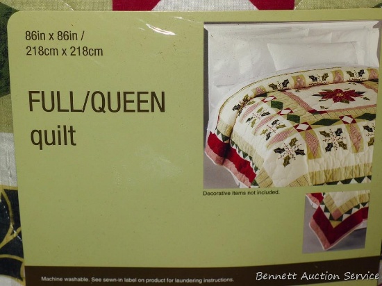 Full/Queen sized Christmas quilt is new in package.