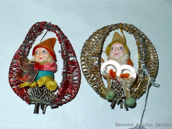 Antique Christmas figures or ornaments. Each has a string to hang and a foot to stand, 4" tall.