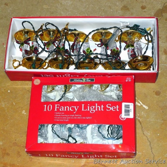 Two sets of 10 fancy Christmas lights as pictured. Both come in original boxes. One is angels and
