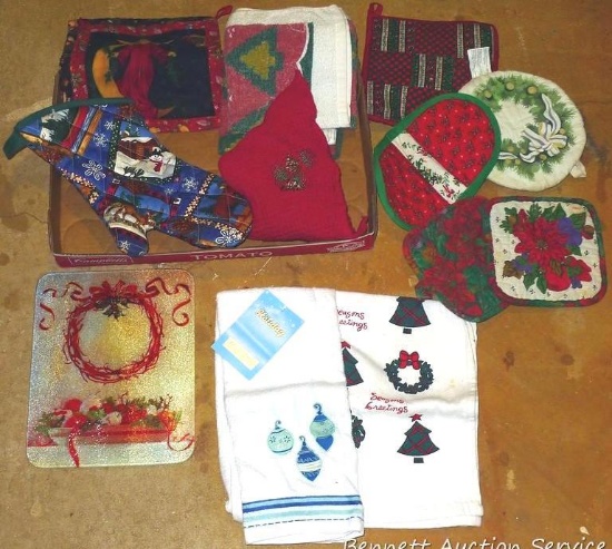 Holiday patterned glass cutting board is 8" x 10"; plus holiday hot pads, kitchen towels, etc.