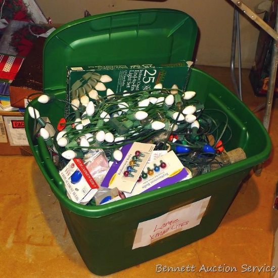 18 gallon tote filled with strings of large Christmas lights.