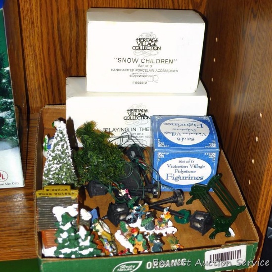 Christmas village accessories including people, trees, train, more.