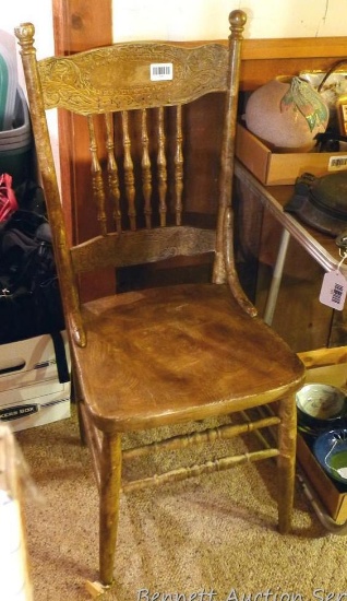 Vintage Wooden pressed back chair. Sturdy, but has been repainted. Measures 39 in. tall.