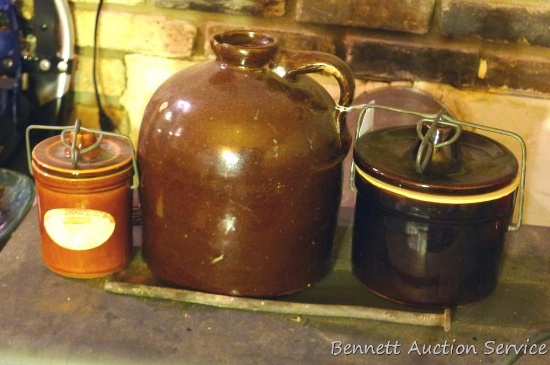 Brown glazed stoneware jug is 9" tall, plus two brown glazed bale top crocks.