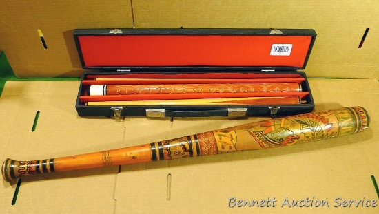 3 piece pool cue with case, wooden baseball bat that has been turned into Native American artwork.