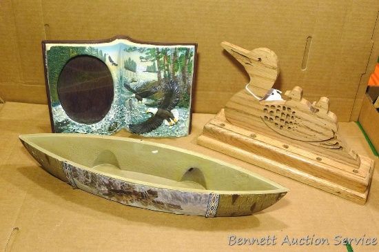 Rustic decor including canoe, picture frame, wooden loon. Sizes measure from 9-14? long.