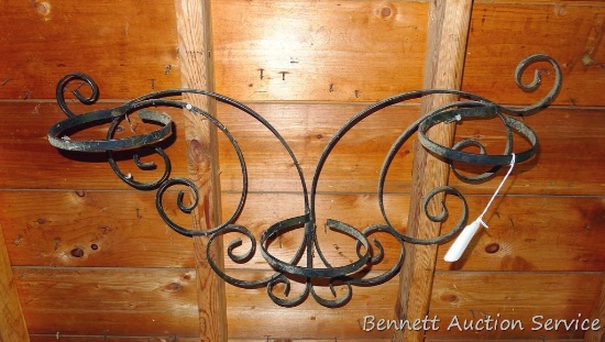 Wrought iron wall mountable potted plant holder is 2-1/2' wide and takes 6" pots.