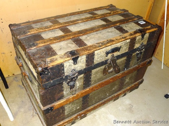 Steamer trunk is 33" wide and is in good condition.