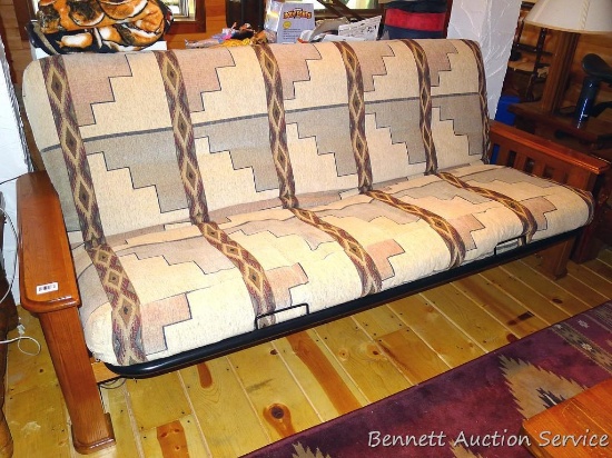 Wood framed futon is about 7" x 3" x 3' tall when set up as a couch. Whole piece look to be in nice