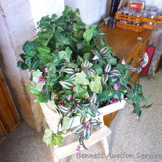 Three faux plants in planters, each approx. 12" x 12".