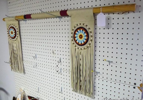 Beaded leather accents on wooden dowel. Nice beadwork. Dowel is nearly 4'.