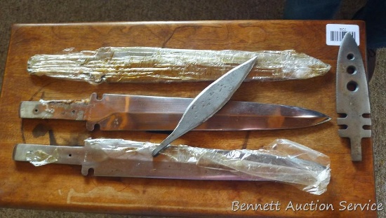 Three 17" knife blades, plus a couple of smaller blades. All are ready for finishing.