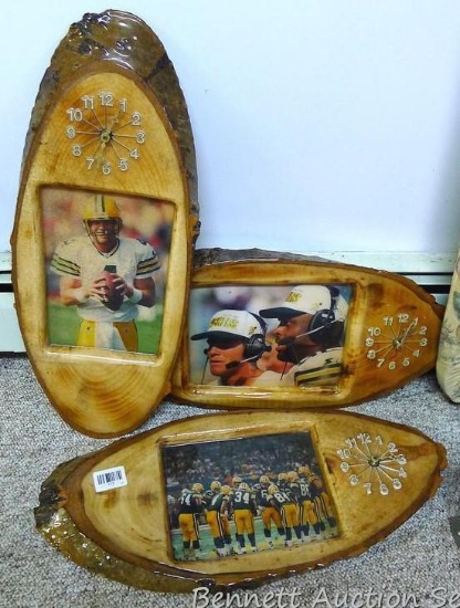 Three wooden clocks with photos of various Green Bay Packers are each approx. 24".